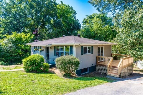 3224 Through St, Chattanooga, TN 37411 - view of front facade featuring a front lawn and a wooden deck