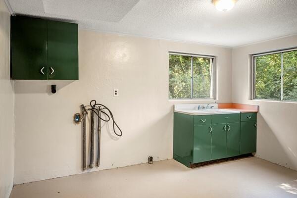 3224 Through St, Chattanooga, TN 37411 - laundry area featuring cabinet space and a textured ceiling