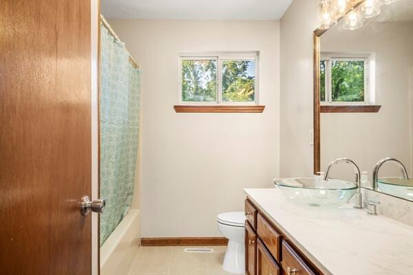 3224 Through St, Chattanooga, TN 37411 - full bath featuring double vanity, tile patterned flooring, and shower / bath combo with shower curtain