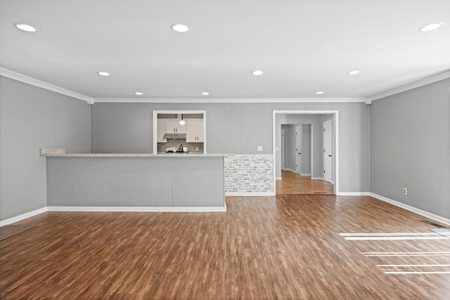 76 Roswell Rd, Rossville, GA 30741 - unfurnished living room with ornamental molding, wood finished floors, and recessed lighting