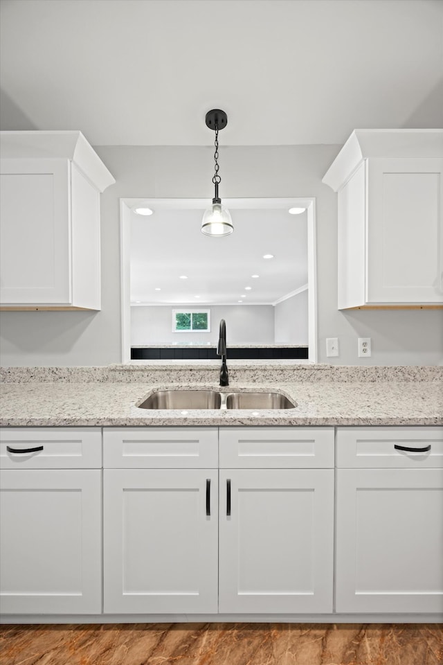 76 Roswell Rd, Rossville, GA 30741 - kitchen with white cabinetry, hanging light fixtures, and light stone countertops