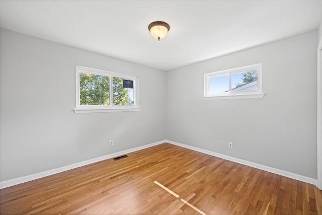 76 Roswell Rd, Rossville, GA 30741 - spare room with plenty of natural light and light wood-style floors
