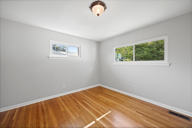 76 Roswell Rd, Rossville, GA 30741 - spare room featuring plenty of natural light and light wood-style floors