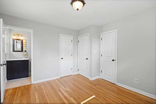 76 Roswell Rd, Rossville, GA 30741 - unfurnished bedroom with light wood-style floors and ensuite bathroom