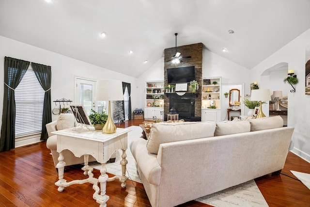 51 Montview Ct, Ringgold, GA 30736 - living room with a ceiling fan, a large fireplace, dark wood-style flooring, arched walkways, and high vaulted ceiling
