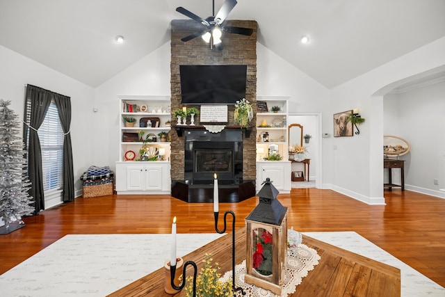 51 Montview Ct, Ringgold, GA 30736 - living room with a ceiling fan, wood finished floors, high vaulted ceiling, a large fireplace, and arched walkways