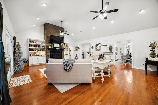 51 Montview Ct, Ringgold, GA 30736 - living area with ceiling fan, high vaulted ceiling, a fireplace, wood finished floors, and arched walkways