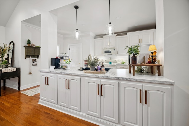 51 Montview Ct, Ringgold, GA 30736 - kitchen featuring white appliances, white cabinetry, a peninsula, light stone counters, and decorative light fixtures
