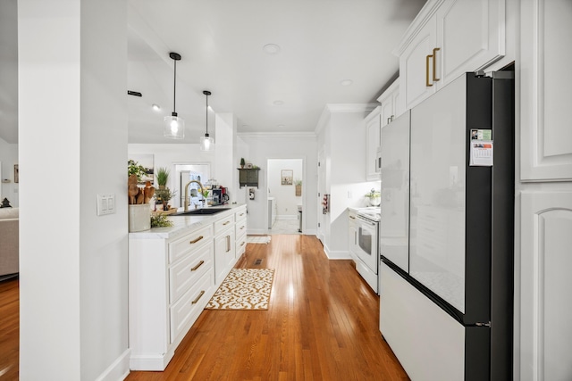 51 Montview Ct, Ringgold, GA 30736 - kitchen featuring white appliances, light wood-type flooring, white cabinetry, pendant lighting, and crown molding