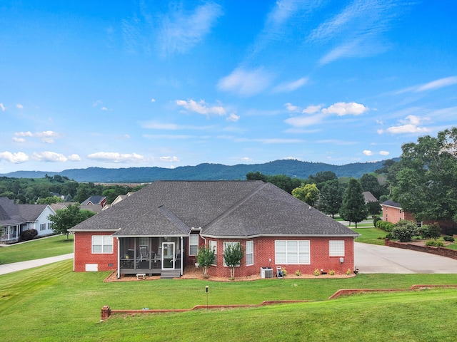 51 Montview Ct, Ringgold, GA 30736 - ranch-style home with a sunroom, a mountain view, a front lawn, brick siding, and a shingled roof