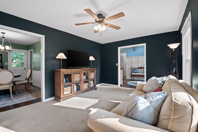 1303 Rockdale Ln, Hixson, TN 37343 - living area featuring a chandelier, a ceiling fan, and carpet