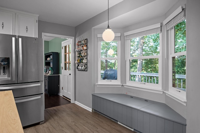 1303 Rockdale Ln, Hixson, TN 37343 - kitchen with stainless steel fridge with ice dispenser, dark wood finished floors, plenty of natural light, and white cabinetry