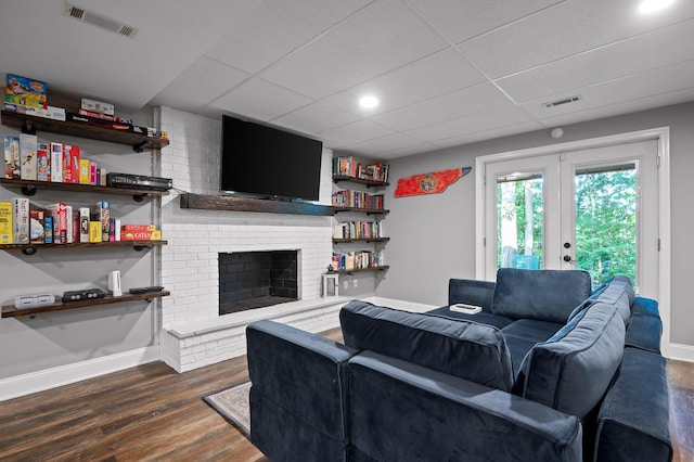 1303 Rockdale Ln, Hixson, TN 37343 - living room with french doors, dark wood-style flooring, a drop ceiling, and a fireplace