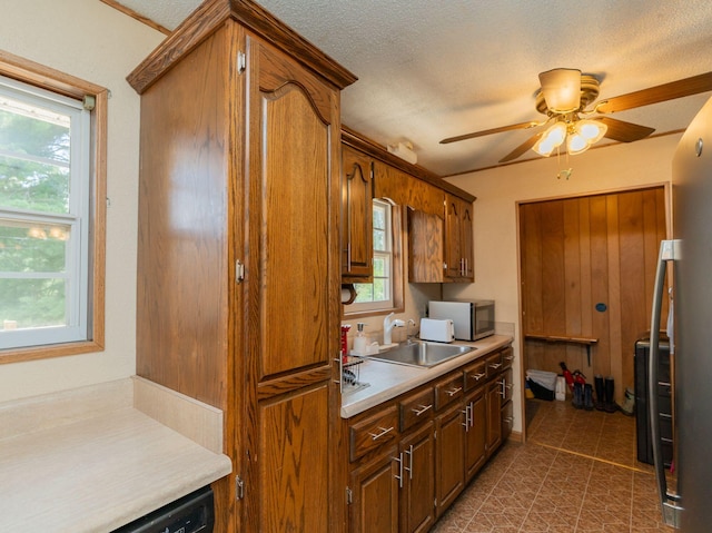515 Choctaw Trl, Chattanooga, TN 37405 - kitchen featuring stainless steel appliances, ceiling fan, light countertops, plenty of natural light, and a textured ceiling