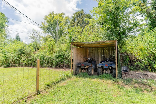 515 Choctaw Trl, Chattanooga, TN 37405 - view of yard featuring a detached carport, an outdoor structure, and an outbuilding