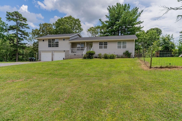 515 Choctaw Trl, Chattanooga, TN 37405 - tri-level home featuring an attached garage, driveway, a front yard, crawl space, and covered porch