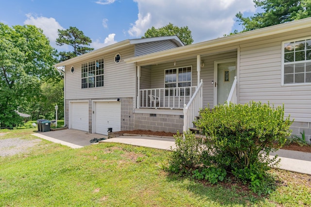515 Choctaw Trl, Chattanooga, TN 37405 - split level home featuring covered porch, driveway, a front yard, and a garage