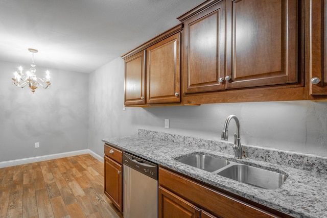 900 Mountain Creek Rd Unit P224, Chattanooga, TN 37405 - kitchen with stainless steel dishwasher, light wood-style floors, a chandelier, light stone countertops, and brown cabinetry