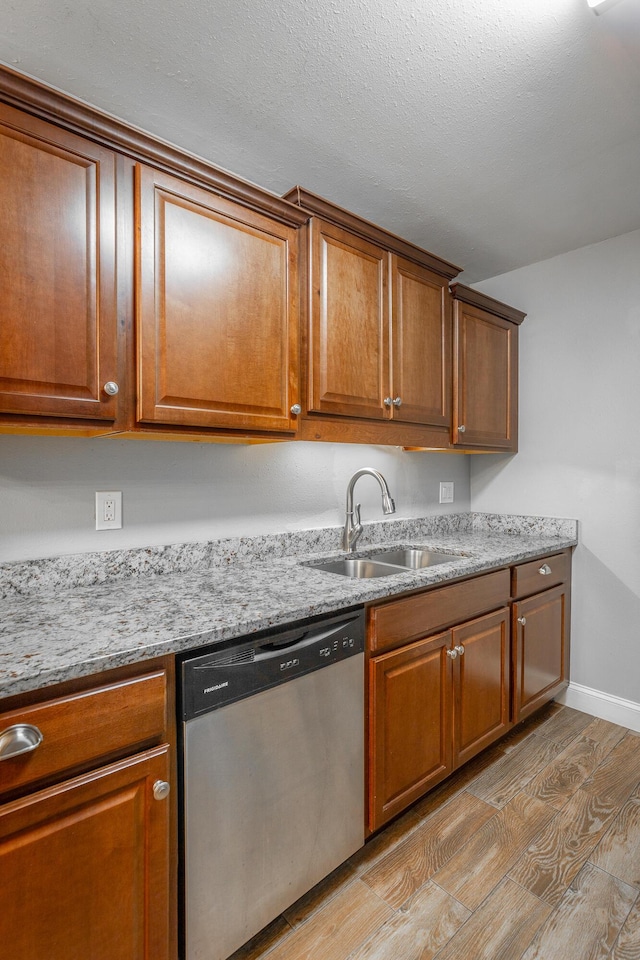 900 Mountain Creek Rd Unit P224, Chattanooga, TN 37405 - kitchen with stainless steel dishwasher, light wood-style floors, and brown cabinets