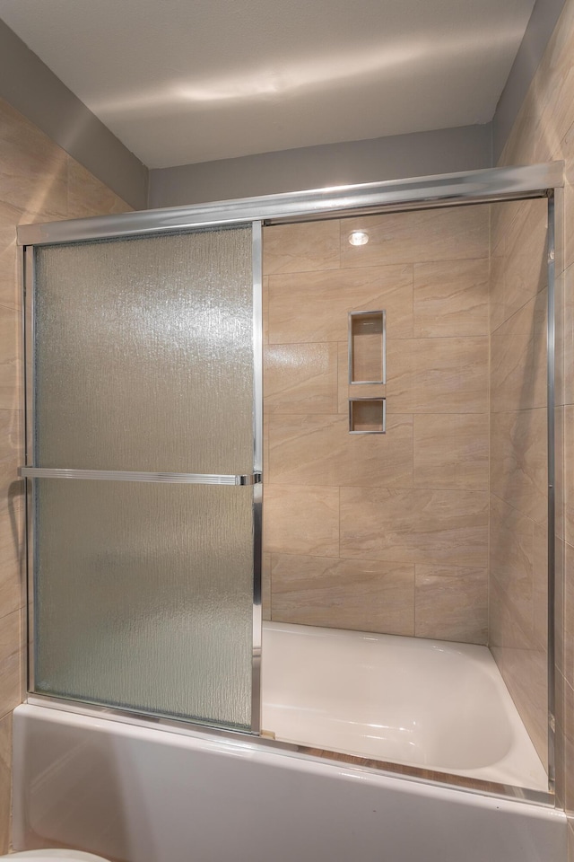 900 Mountain Creek Rd Unit P224, Chattanooga, TN 37405 - bathroom featuring combined bath / shower with glass door