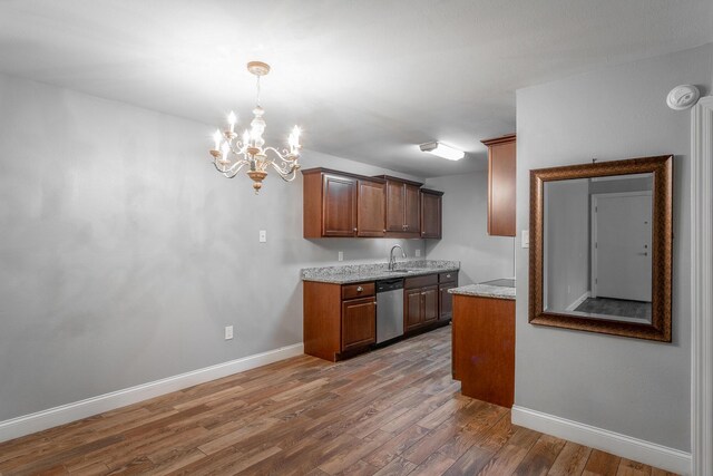 900 Mountain Creek Rd Unit P224, Chattanooga, TN 37405 - kitchen with dishwasher, wood finished floors, a chandelier, light stone countertops, and hanging light fixtures