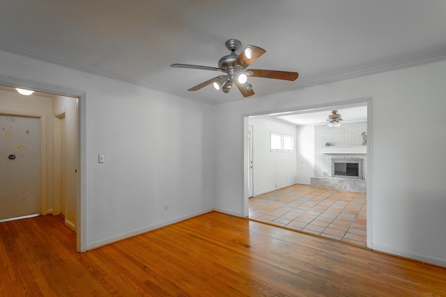 210 Dawn St, Signal Mountain, TN 37377 - unfurnished living room with a ceiling fan, wood finished floors, ornamental molding, and a fireplace