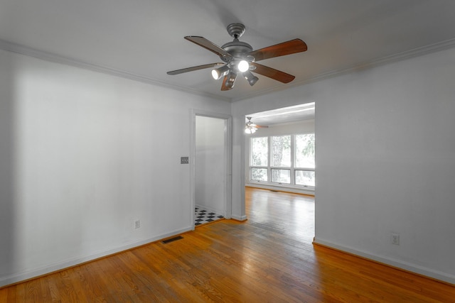 210 Dawn St, Signal Mountain, TN 37377 - spare room with a ceiling fan, wood finished floors, and ornamental molding