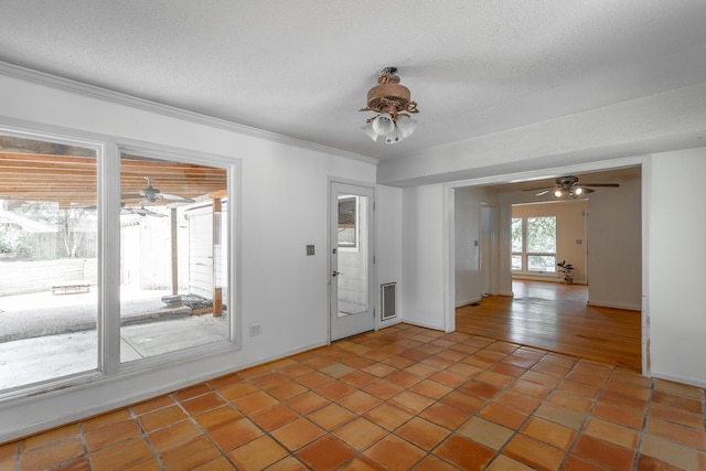 210 Dawn St, Signal Mountain, TN 37377 - spare room with ceiling fan, a textured ceiling, light tile patterned floors, and ornamental molding