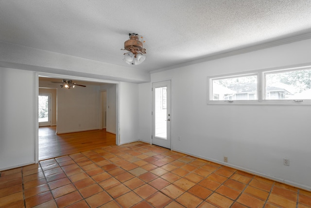 210 Dawn St, Signal Mountain, TN 37377 - spare room featuring light tile patterned floors, a textured ceiling, and crown molding