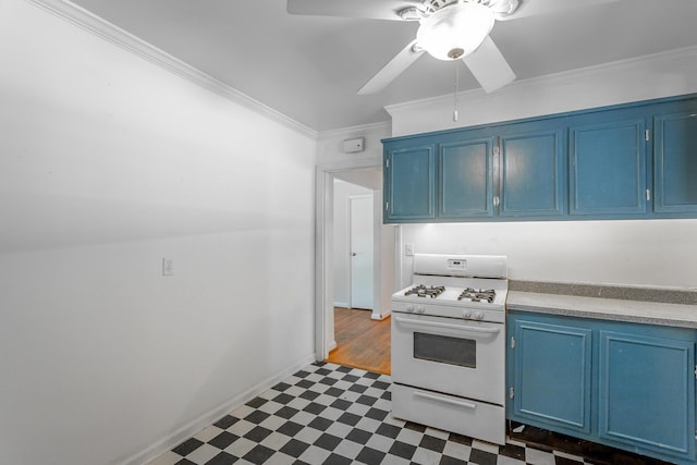 210 Dawn St, Signal Mountain, TN 37377 - kitchen with blue cabinets, gas range gas stove, dark flooring, ornamental molding, and ceiling fan