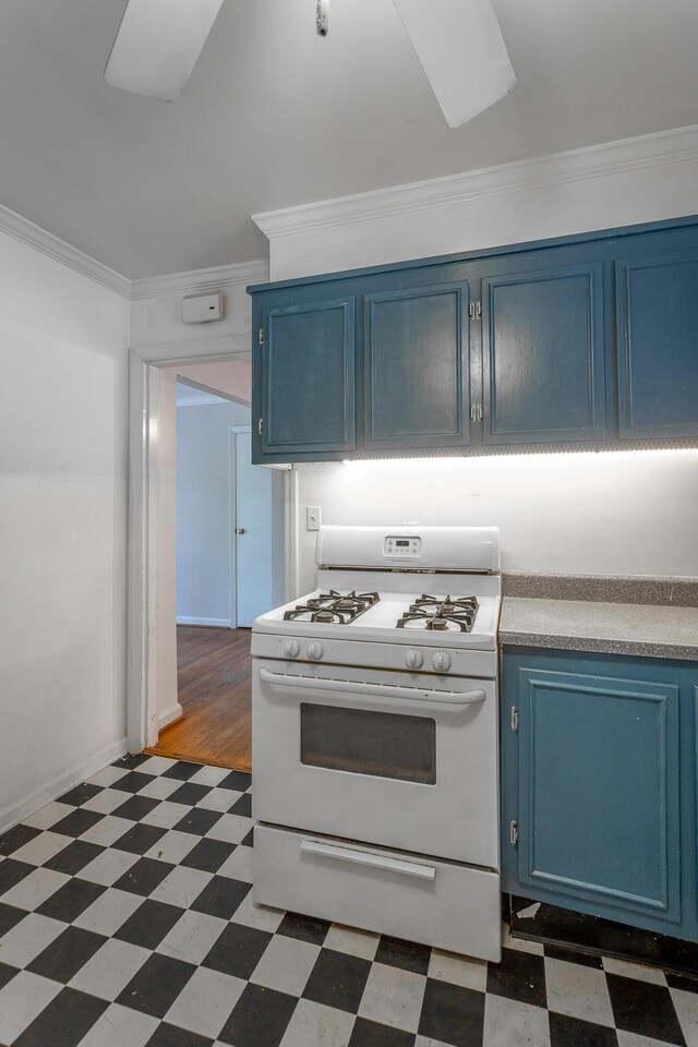 210 Dawn St, Signal Mountain, TN 37377 - kitchen with blue cabinets, dark flooring, white range with gas stovetop, and crown molding
