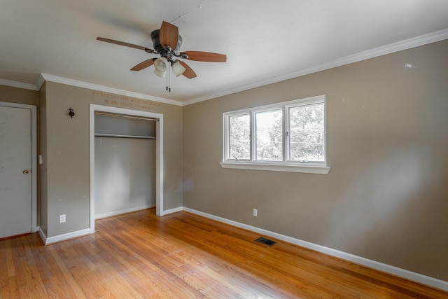 210 Dawn St, Signal Mountain, TN 37377 - unfurnished bedroom with a closet, light wood-style floors, crown molding, and ceiling fan