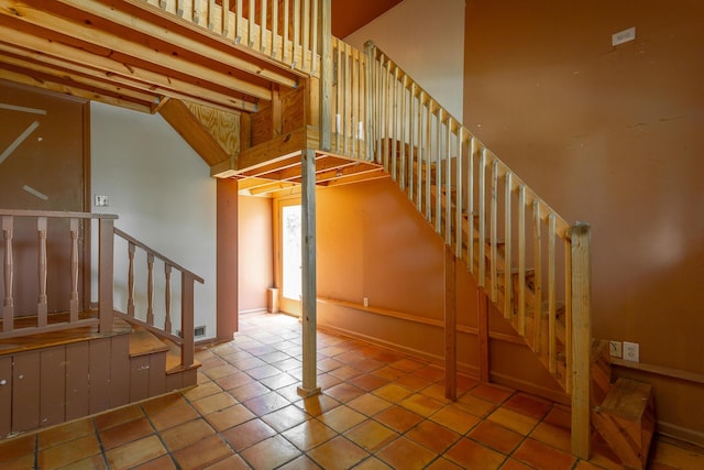 210 Dawn St, Signal Mountain, TN 37377 - stairs featuring tile patterned flooring and a towering ceiling