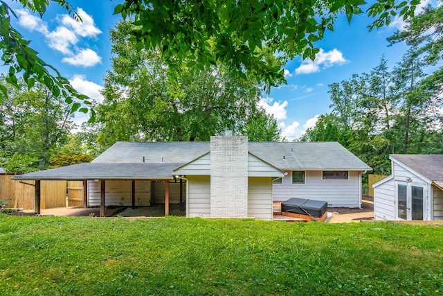 210 Dawn St, Signal Mountain, TN 37377 - rear view of house featuring a yard, a chimney, and a shed