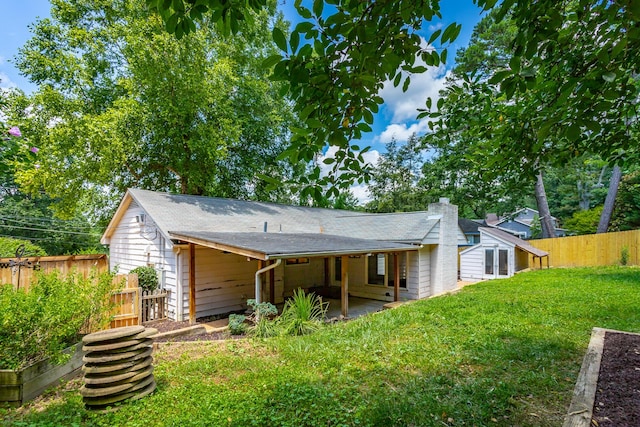 210 Dawn St, Signal Mountain, TN 37377 - back of property featuring a chimney, roof with shingles, and a patio