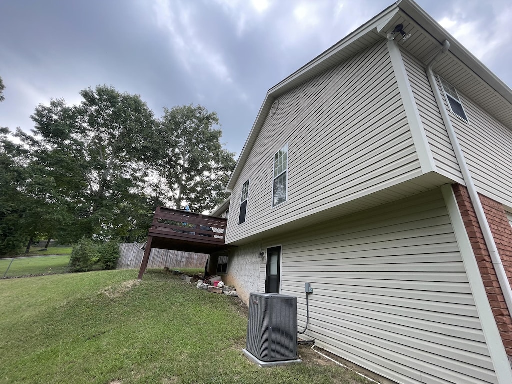 10164 Fielding Rd, Ooltewah, TN 37363 - view of home's exterior featuring a yard and a wooden deck
