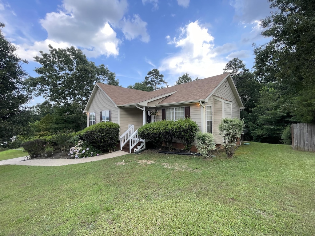 10164 Fielding Rd, Ooltewah, TN 37363 - view of front of property with a front lawn and roof with shingles