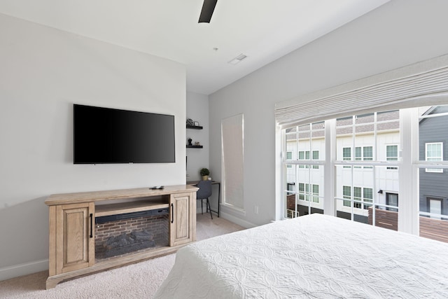 1476 Chatt City Way, Chattanooga, TN 37408 - bedroom with light colored carpet, a fireplace, ceiling fan, and vaulted ceiling