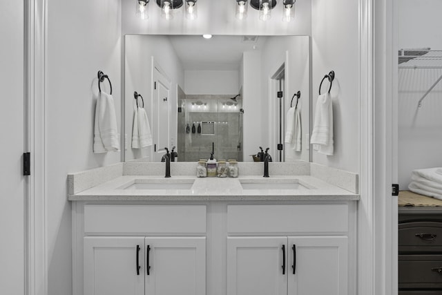 1476 Chatt City Way, Chattanooga, TN 37408 - bathroom with a stall shower, double vanity, and a walk in closet