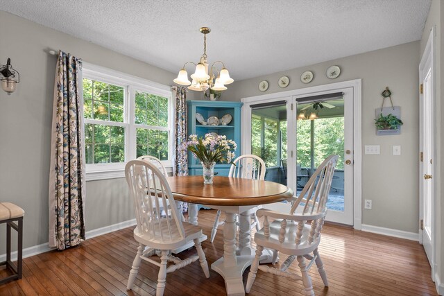 6233 Brenda Ct, Harrison, TN 37341 - dining area featuring hardwood / wood-style floors, a chandelier, and a textured ceiling