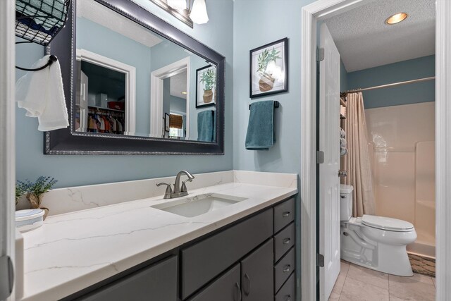 6233 Brenda Ct, Harrison, TN 37341 - bathroom with vanity, a textured ceiling, and curtained shower