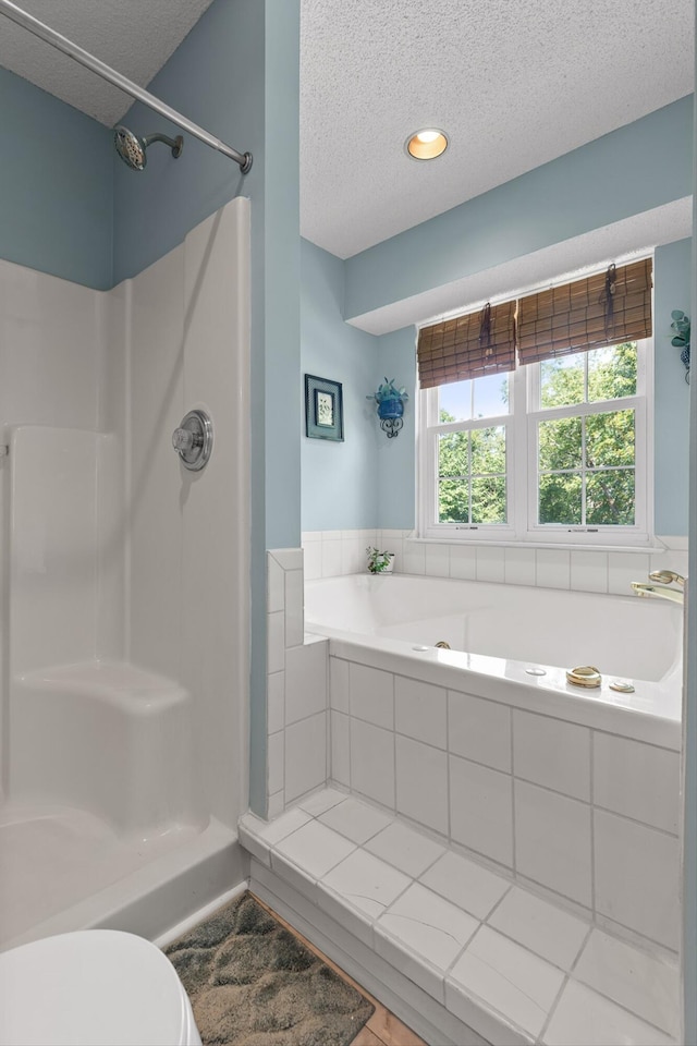 6233 Brenda Ct, Harrison, TN 37341 - bathroom featuring a textured ceiling, a bath, and a shower