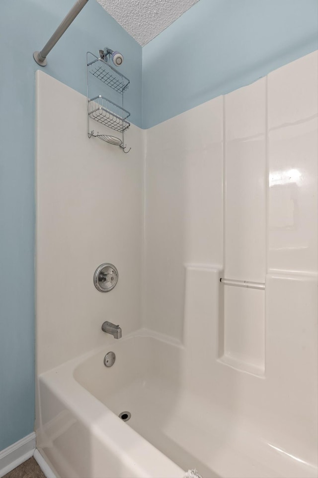 6233 Brenda Ct, Harrison, TN 37341 - bathroom with shower / bath combination and a textured ceiling