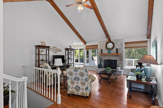 6233 Brenda Ct, Harrison, TN 37341 - living room with high vaulted ceiling, beamed ceiling, a fireplace, wood finished floors, and a ceiling fan