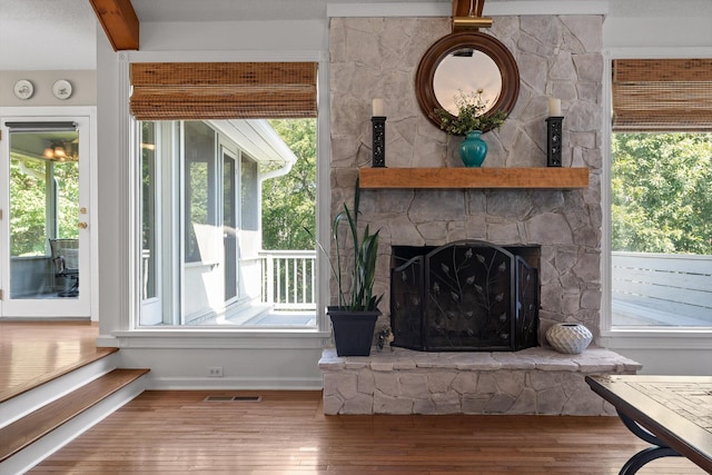 6233 Brenda Ct, Harrison, TN 37341 - living area with hardwood / wood-style flooring, beamed ceiling, and a fireplace