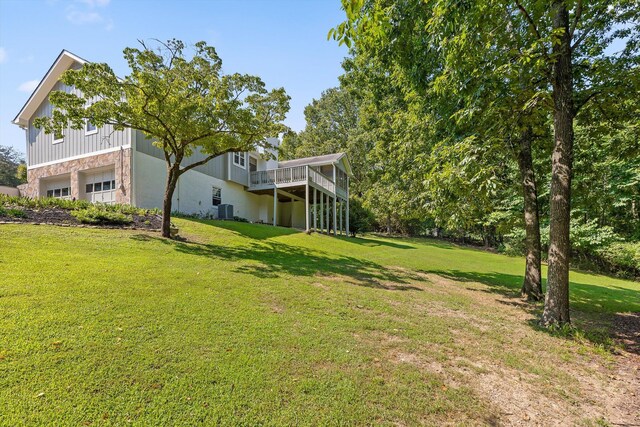 6233 Brenda Ct, Harrison, TN 37341 - view of grassy yard with an attached garage and a wooden deck