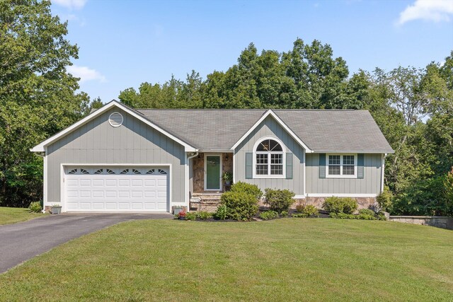 6233 Brenda Ct, Harrison, TN 37341 - ranch-style house with driveway, a garage, a front lawn, stone siding, and roof with shingles