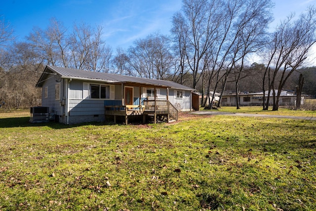 1153 Coffelt Rd, Hixson, TN 37343 - rear view of house with a metal roof, crawl space, a lawn, covered porch, and driveway