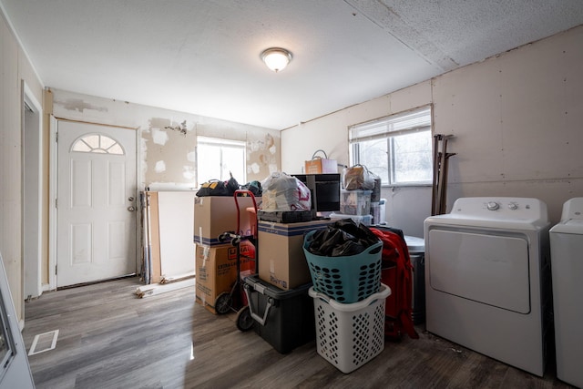 1153 Coffelt Rd, Hixson, TN 37343 - laundry area featuring washing machine and clothes dryer, plenty of natural light, and wood finished floors