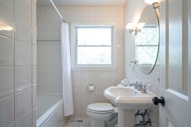 3707 Norma Dr, Chattanooga, TN 37412 - full bathroom featuring tile walls, shower / bath combo with shower curtain, and tile patterned flooring
